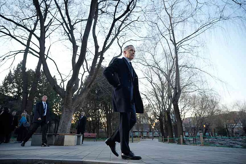 Canada's Prime Minister Mark Carney, leaves after speaking to the media at Ritan Park in Beijing, China, Friday, Jan. 16, 2026. (AP Photo/Vincent Thian)