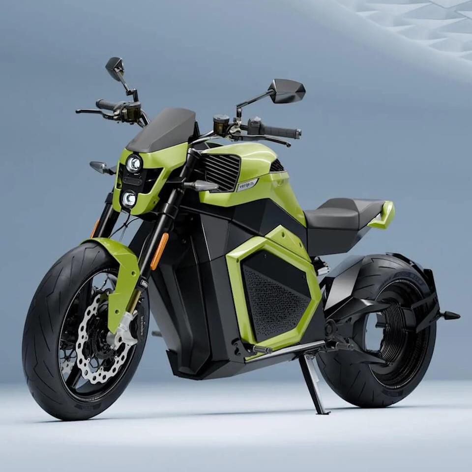 Electric motorcycle with lime green and black body and dual round headlights on a gray background.