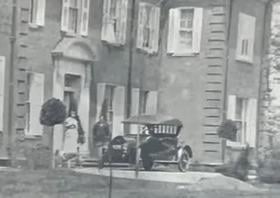 Could you help me identify the year, make and model of this car parked in front of our home (NY State)?