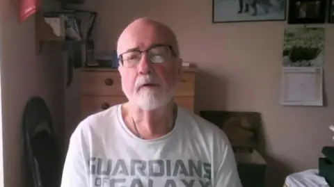 Paul Horwood in his home in Colchester