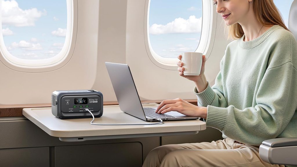 woman on airplane with Bluetti Elite 10 Mini power station