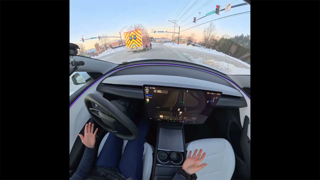 Tesla FSD v14 hears an ambulance, gives it way before the human could listen to the siren (video screenshot).