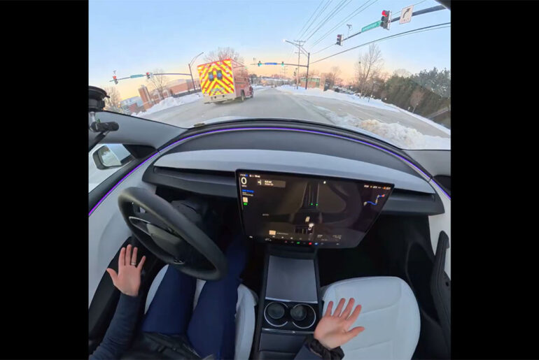 Tesla FSD v14 hears an ambulance, gives it way before the human could listen to the siren (video screenshot).