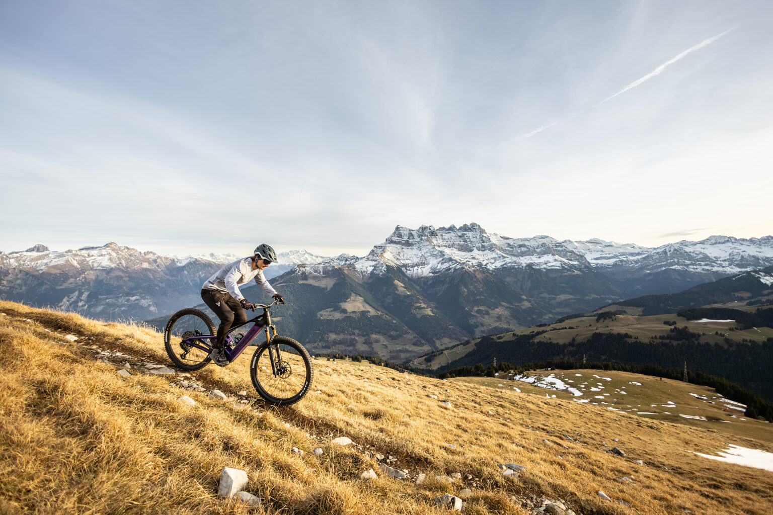 A rider on the Scree with mountains in the background