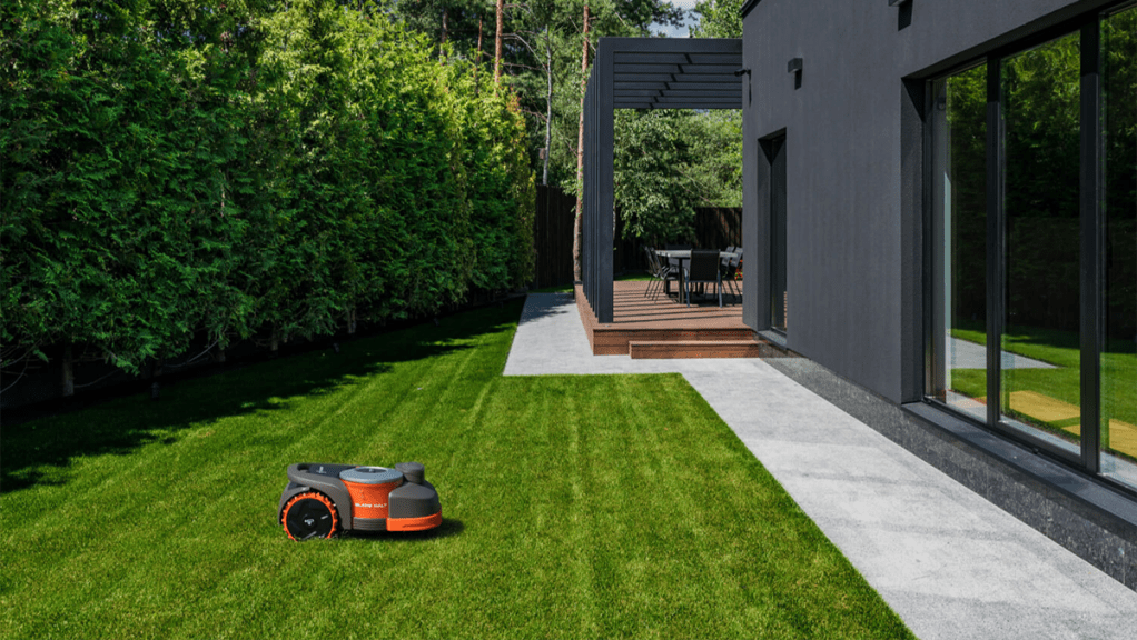 Segway Navimow robot lawn mower in fresh cut yard