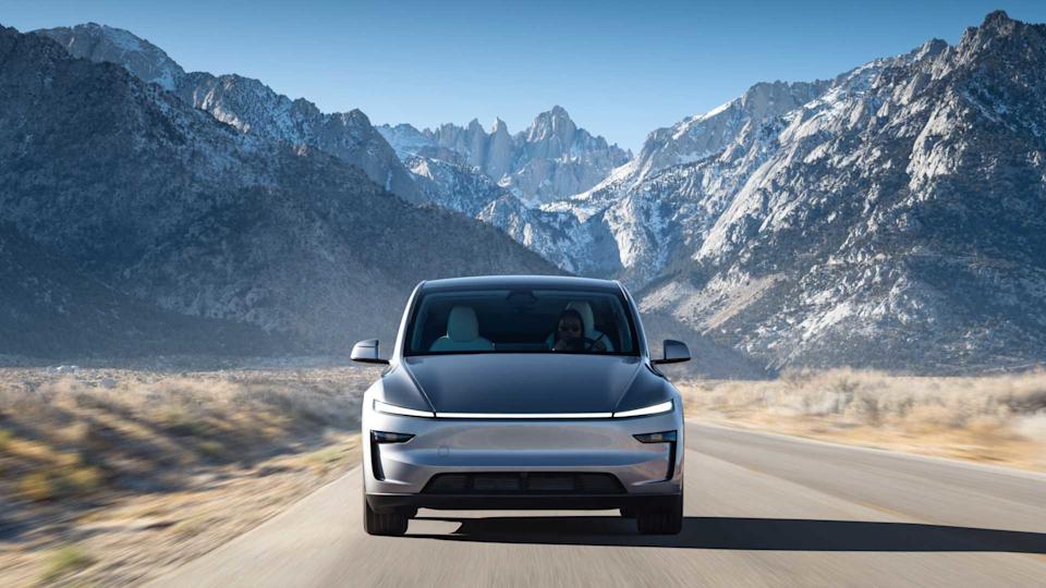Dynamic front-end shot of a silver 2026 Tesla Model Y.
