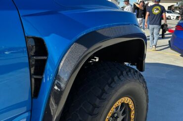 Carbon fiber fenders and gold shocks on this dodge ram trx widebody