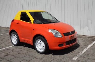 A Suzuki Swift transformed into a Little Tikes Cozy Coupe