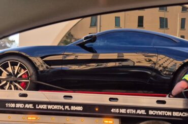 [Aston Martin Vantage] also being taken off a flatbed at the dealer...
