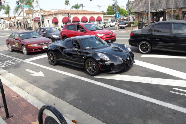 Look at this [Alfa Romeo 4C] I snapped a pic of in 2017. Then check out the weird face the woman had; she probably thought I was taking pics of her lol