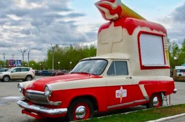 That is a vintage GAZ-21 Volga car that has been rebuilt into an ice cream truck.