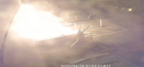 Surveillance footage of fire at a Tesla dealership.