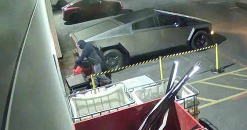 Surveillance footage of an arsonist pouring gasoline next to a Tesla Cybertruck.