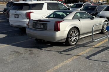 A [Cadillac XLR-V] in the Walmart parking lot.
