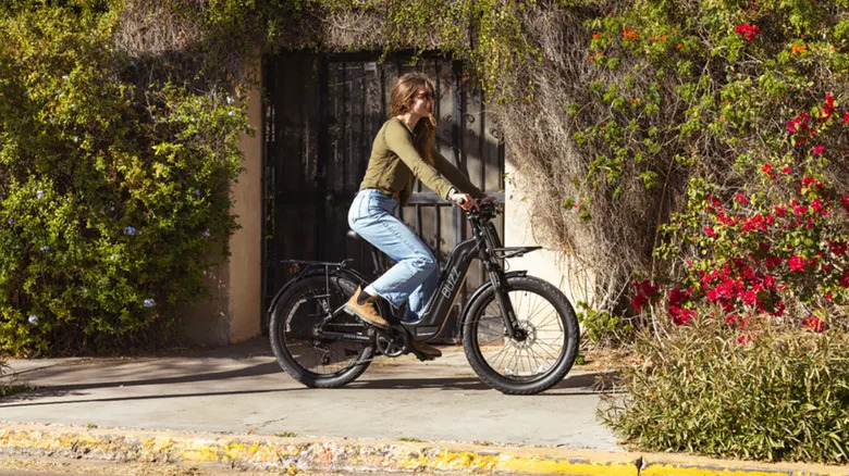 A woman riding the Buzz Cerana e-bike.