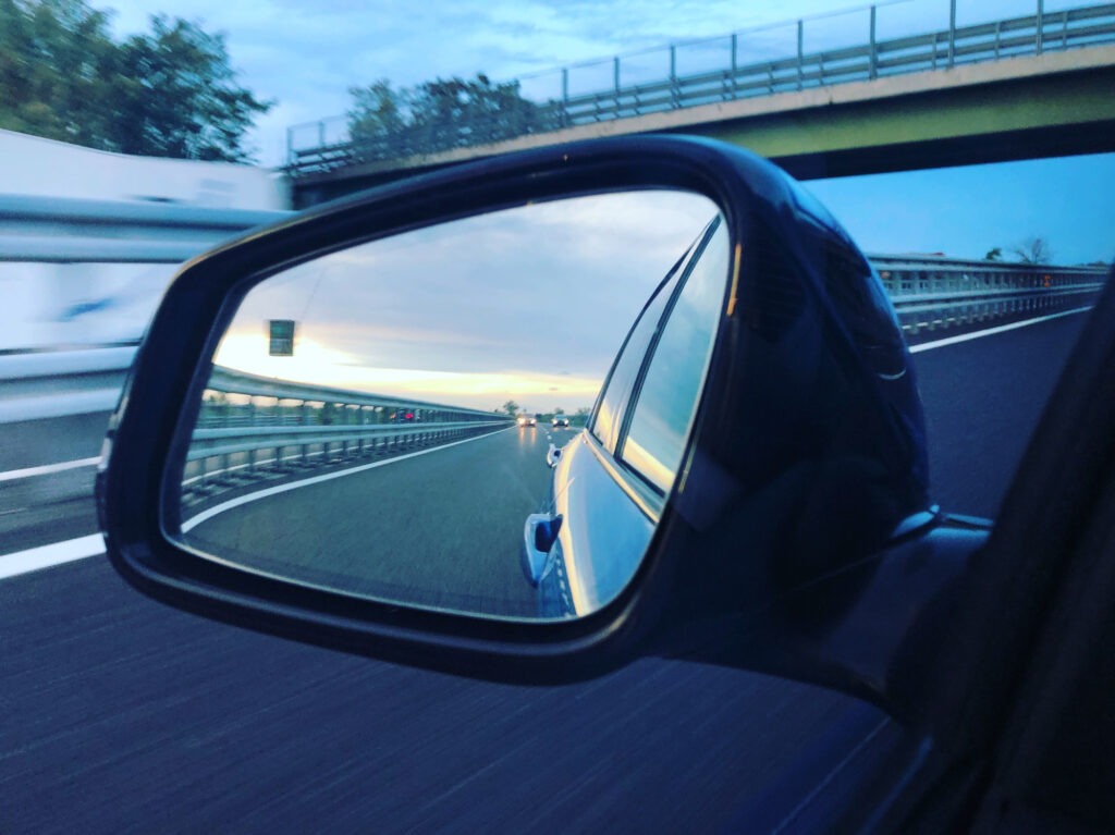 Sunset in automotive mirror