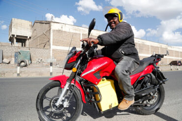 FILE -A man rides an electric motorcycle from Ampersand on a test drive in Nairobi, Kenya, Jan. 23, 2023. (AP Photo/Brian Inganga, File)