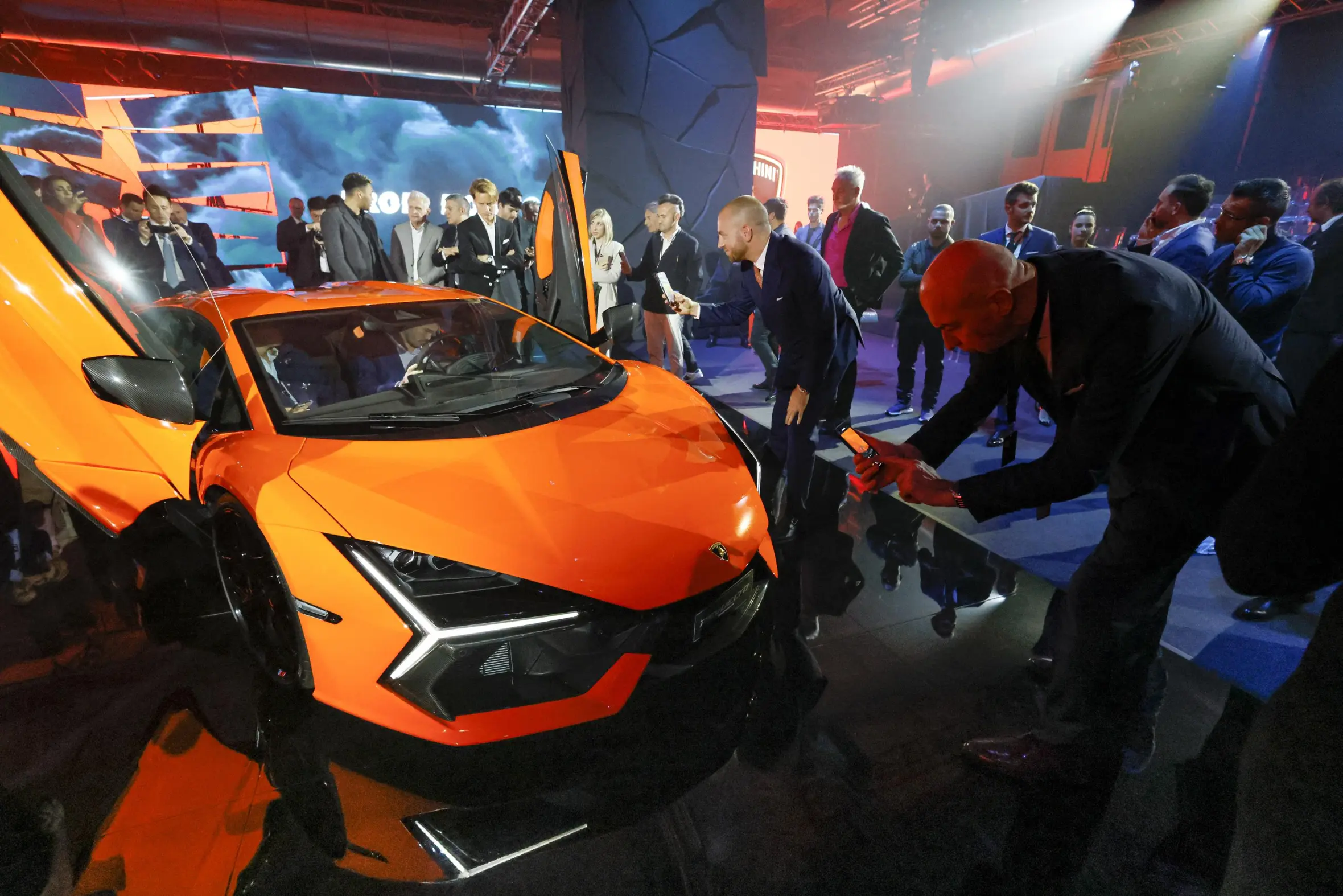 People gathered around the new Lamborghini Revuelto.