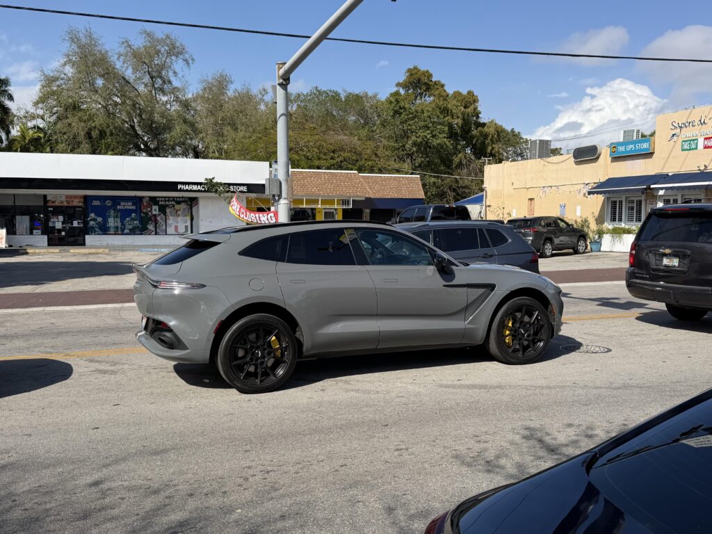 [Aston Martin DBX] in school pickup duty