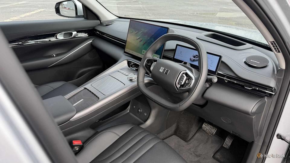 Shot inside the cabin of a 2026 Geely Starray EM-i, showing the driver and passenger black leather seats and dashboard.