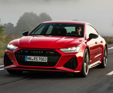 Red 2024 Audi RS7 Sportback on the road