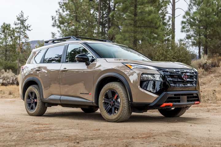 2025 Nissan Rogue Rock Creek Bronze Front Angle on Dirt