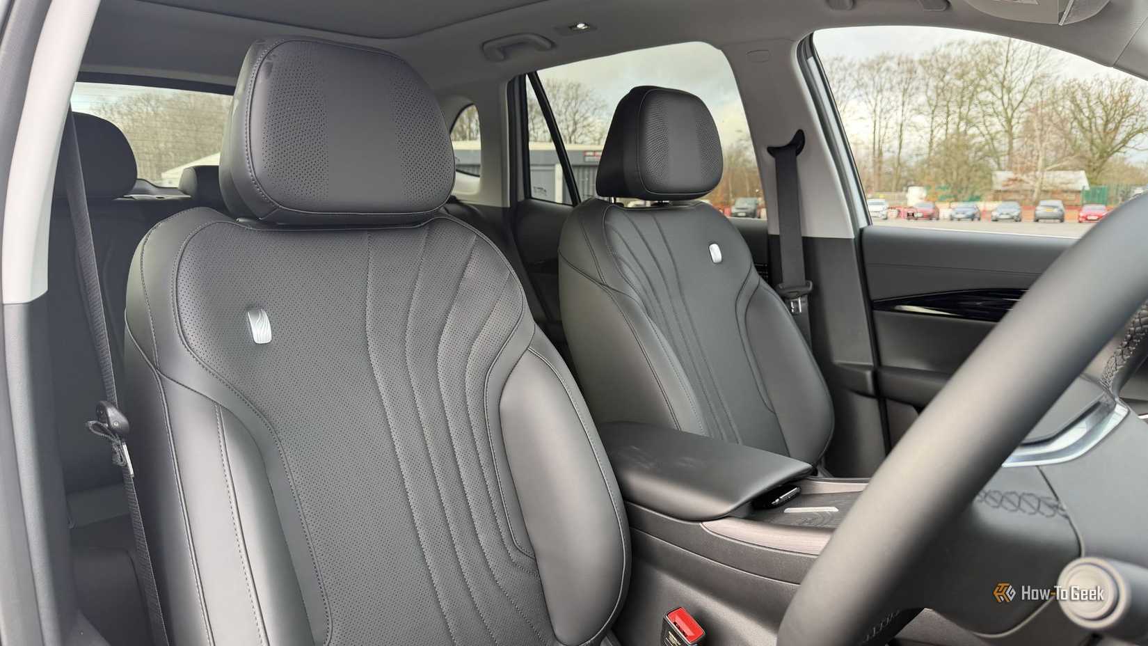 Close-up shot of the driver and passenger black leather seats inside the cabin of a 2026 Geely Starray EM-i.