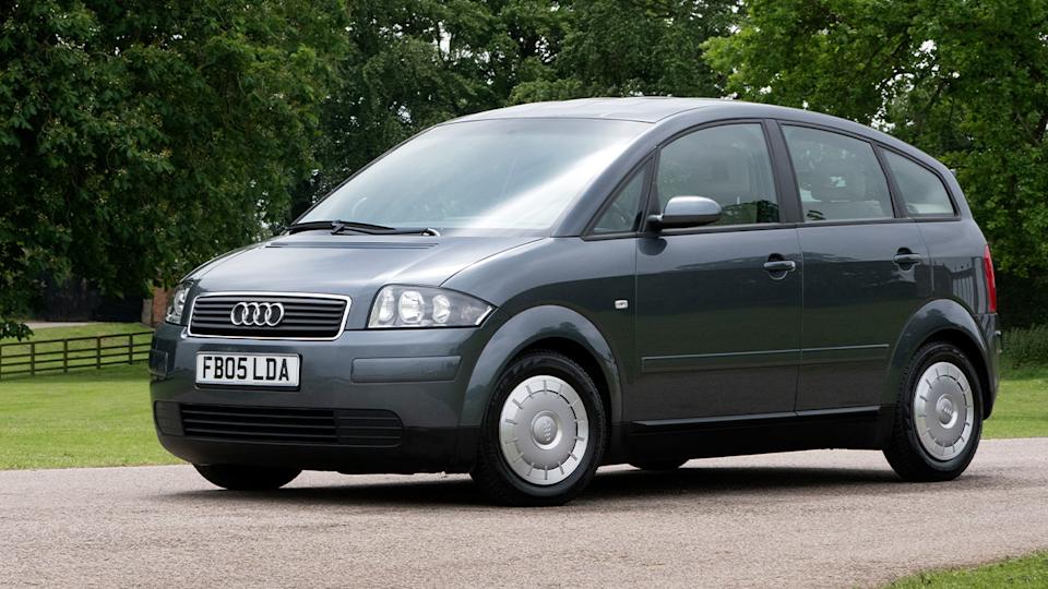 A gray Audi A2 with small aerodynamic hubcaps, front 3/4 view