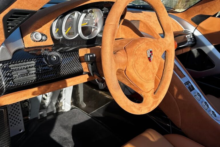 [porsche Carrera GT] but it has a Valvetronic badge on the back. The guy was doing some burnouts/skids lol he just got the car