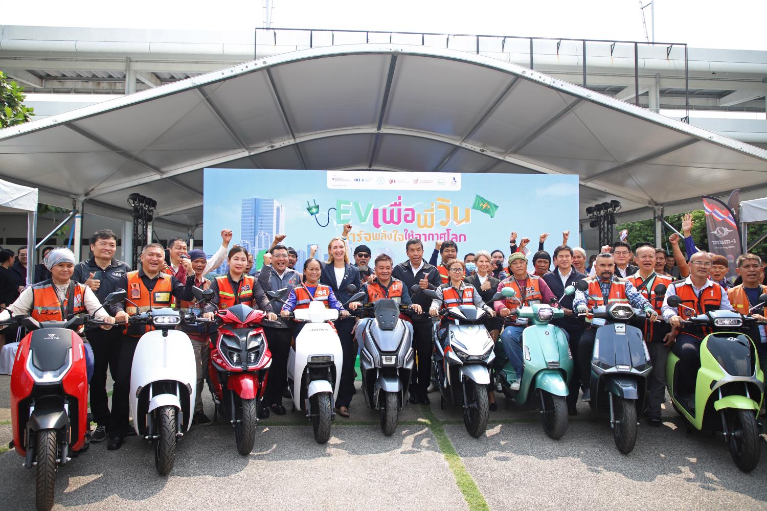 Bangkok governor Chadchart Sittipunt together with motorcycle riders at the launch event.