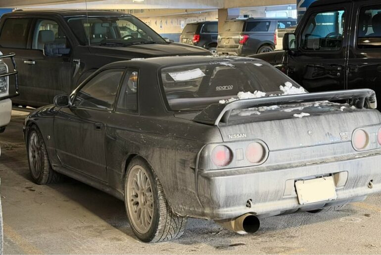 Dirty [RHD R32 Skyline GTR] in a parking garage in Alaska