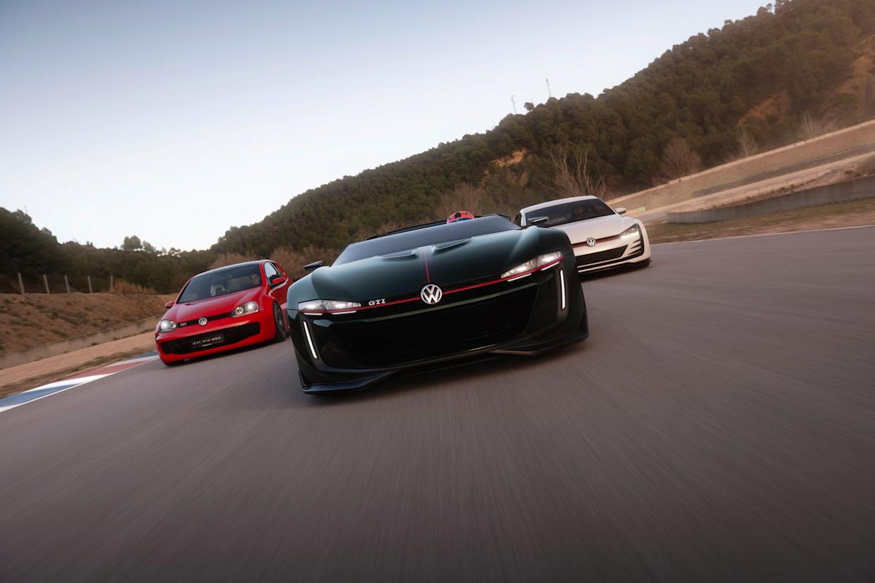 three volkswagen cars racing on a track