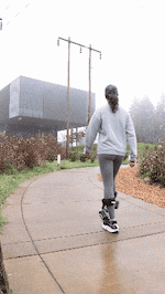 Chloe Veltman walks outside wearing the Nike Amplify system at the Nike campus in Beaverton, Oregon.