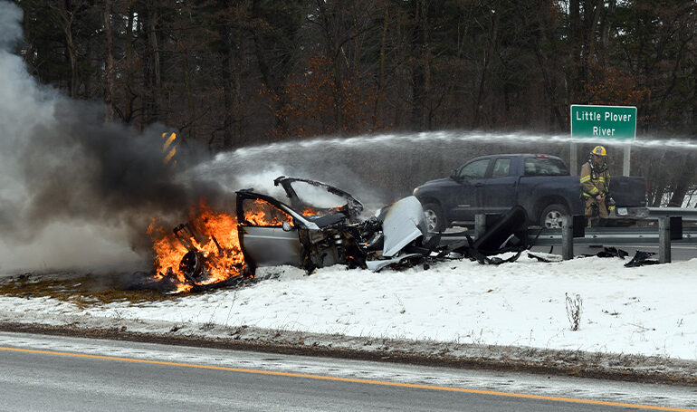 Plover firefighters monitor Tesla fire on I-39 after crash