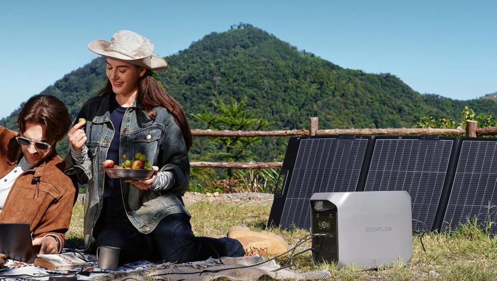 man and woman having picnic with ecoflow power station