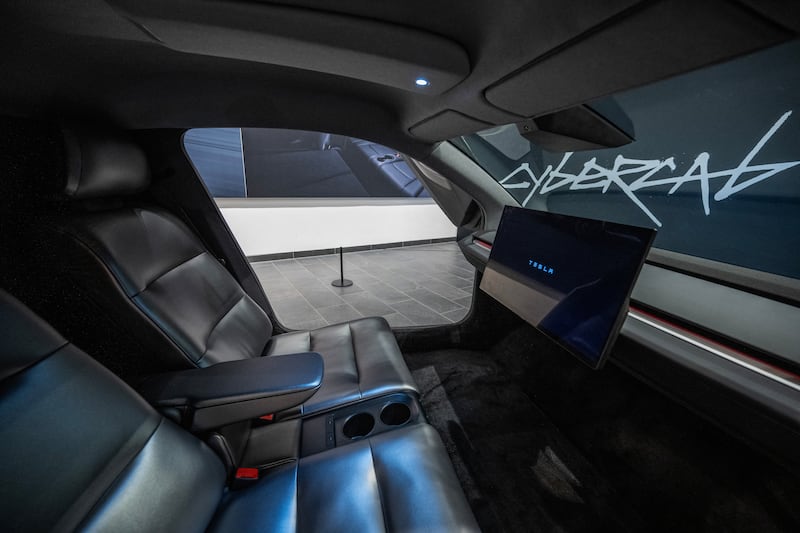 Inside the two-seater Cybercab, there are no pedals, steering wheel, or driver controls. Photograph: John MacDougall/AFP via Getty Images