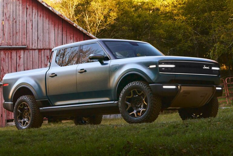 A 2027 Scout Terra in blue from a quarter front angle view.