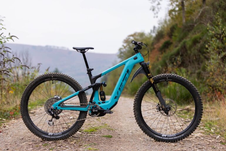 Yeti LTE T4 shot from the drive side on a fire road.