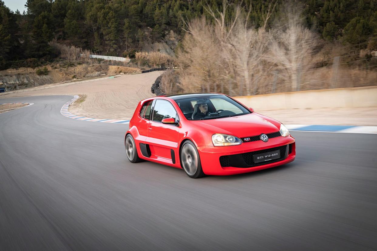 sporty red volkswagen car on a racetrack