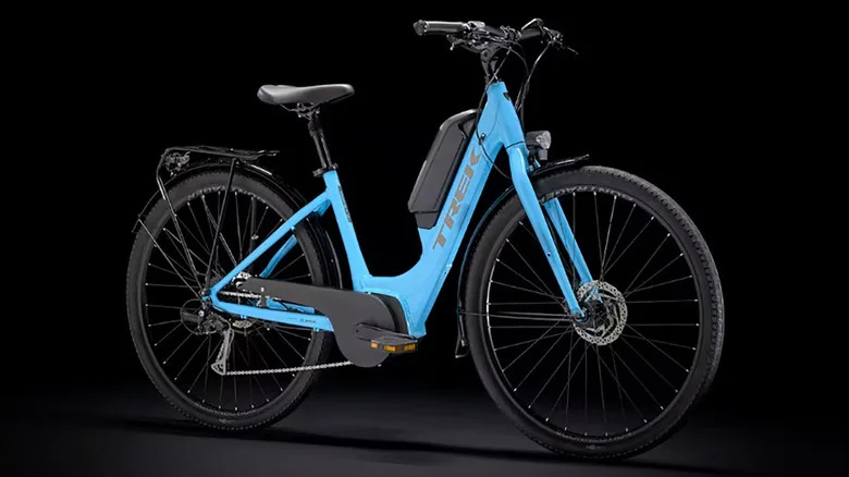 The Trek Verve+ 2 lowstep e-bike on a black background.