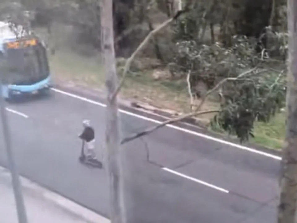 A child on a scooter leads the group along the T-way, a road reserved exclusively for authorised buses and service vehicles. Picture: Facebook