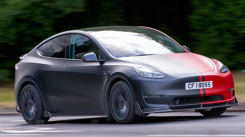 a Tesla Model Y driving down a road