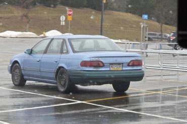 1994 Ford Taurus parked at Walmart in 2026.