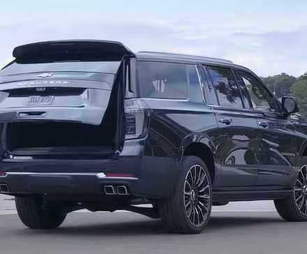 2025 Chevrolet Suburban in black parked in parking lot