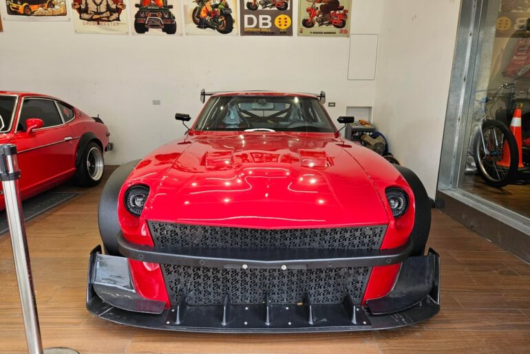 2 [Datsun 240Z] sitting in a coffee shop