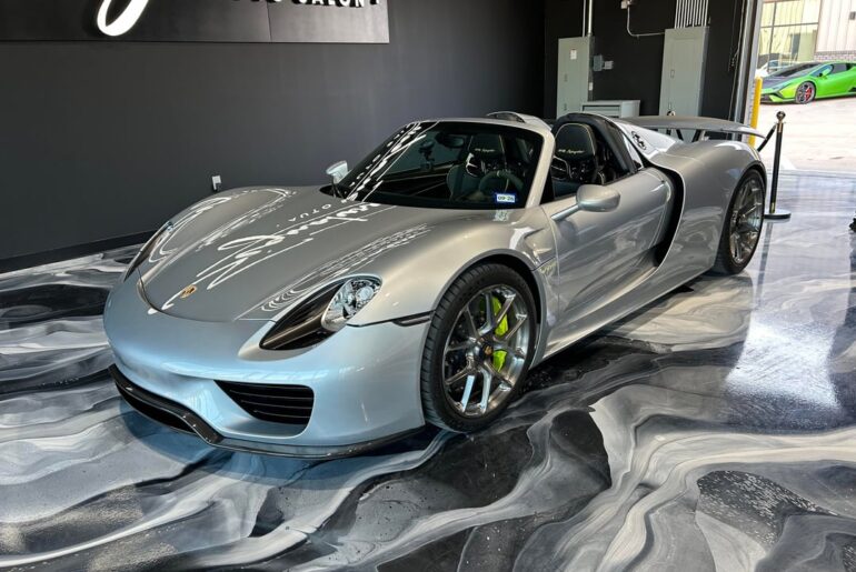 A collection of [Porsches] at a car show today