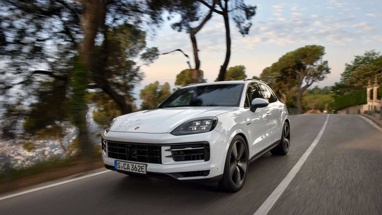 Front quarter view of the Porsche Cayenne E-Hybrid driving.