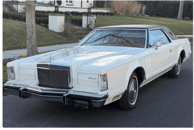 230 Inches Long, 7.5 Liter V8, and Opera Windows.