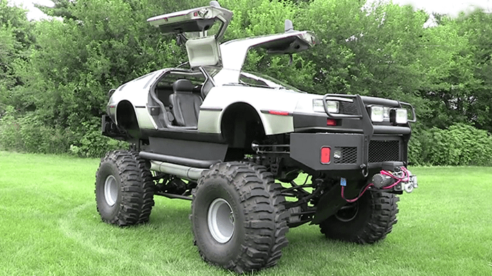 A photo of a DeLorean that was turned into a monster truck.