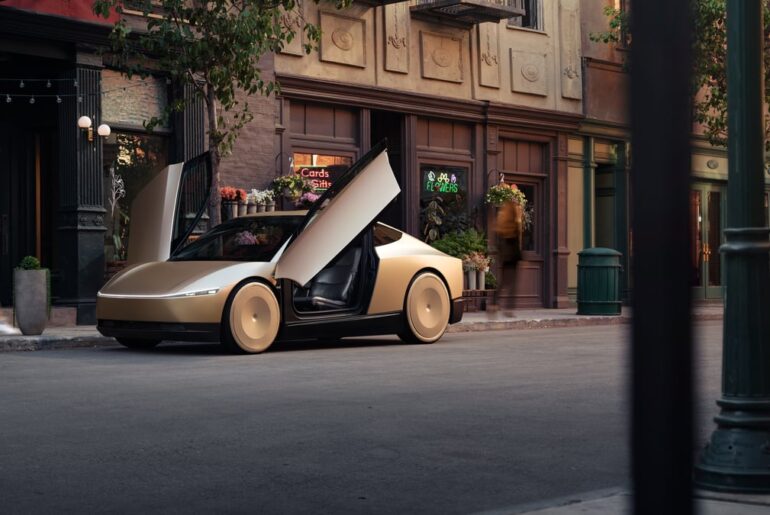 A Tesla Cybercab parked on the side of the street with its doors open.